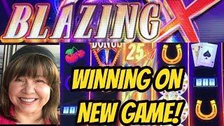 INSERT $100-CASH OUT AT? NEW GAME WINNING! BLAZING X