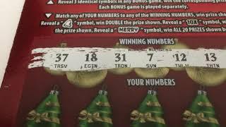 Merry Millionaire! Scratching another $20 ticket