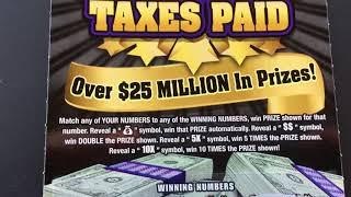 Scratching off a Taxes Paid Instant Scratchcard Lottery Ticket