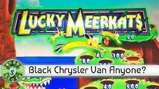 Lucky Meerkat$ slot machine & a Black Chrysler Van