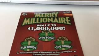 Scratching off a $20 Merry Millionaire Instant Lottery ticket