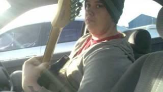 Alex playing guitar in a ford mondeo in wisbech 2006