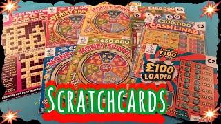 Scratchcards..MONEY SPINNER..£100 LOADED..MEGA CASHWORD..RAINBOW BINGO..WIN £50..CASH MATCH.£100,000