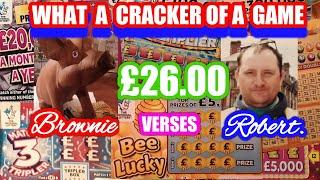Cracking Scratchcard Game."Robert Vs Brownie"Merry Millions..£250,000.Blue.BINGO.Pot of Gold.B-Lucky