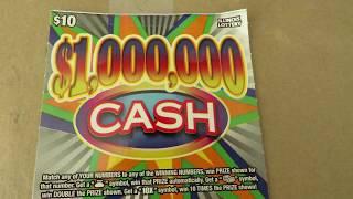 Scratching off a $1,000,000 CASH instant lottery ticket
